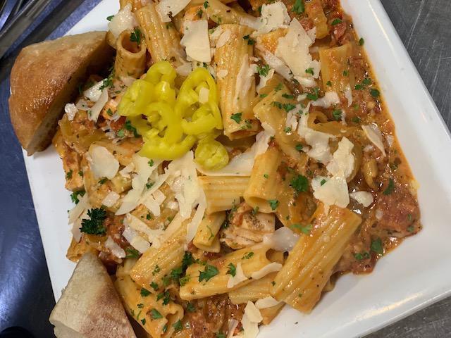 Riggies · Rigatoni pasta tossed in a vodka cream sauce, cherry pepper relish, banana peppers, and Parmesan cheese. Add protein for an additional charge.