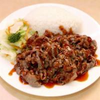 Teriyaki Beef · Thin sliced beef marinated and cooked in special sauce. Served with steamed rice and stir-fr...