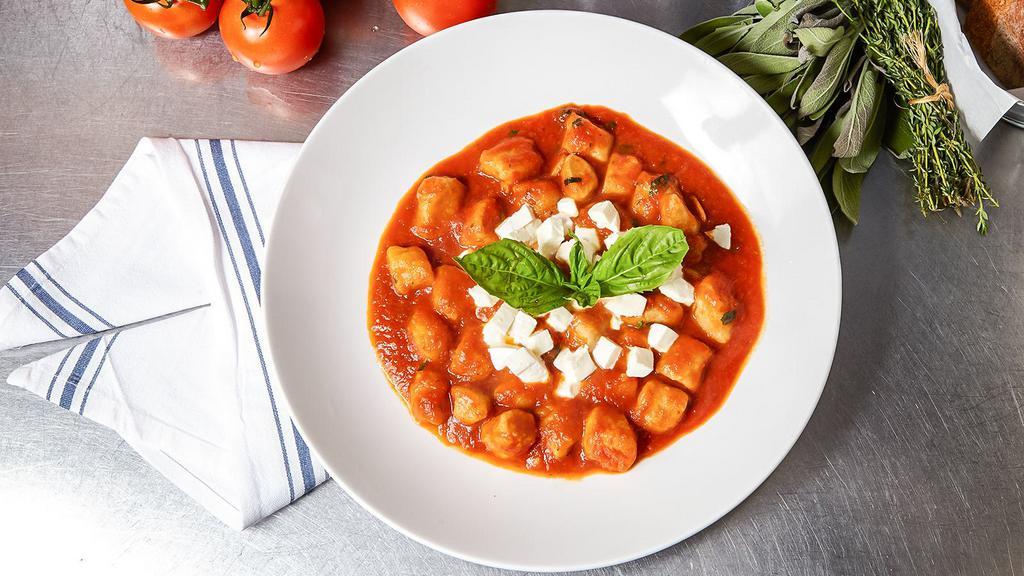 Gnocchi alla Sorrentina · Campania. Potato dumplings in tomato sauce, with basil and fresh mozzarella.
