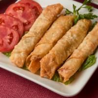 Sigara Borek · Lightly pan-fried phyllo rolls stuffed with feta cheese. 