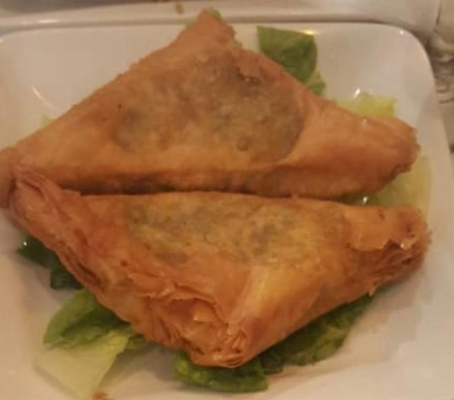 Spinach Borek · Lightly pan-fried phyllo dough stuffed with spinach, onions and feta cheese. 