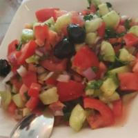 Coban Salad · Fresh chopped tomatoes, onions, cucumbers, green peppers, parsley and house dressing. Served...