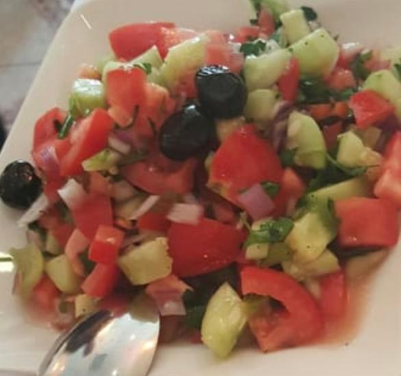 Coban Salad · Fresh chopped tomatoes, onions, cucumbers, green peppers, parsley and house dressing. Served with pita bread.