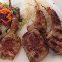 Baby Lamb Chops · Char grilled lamb chops served with rice and salad. (3 pieces) 