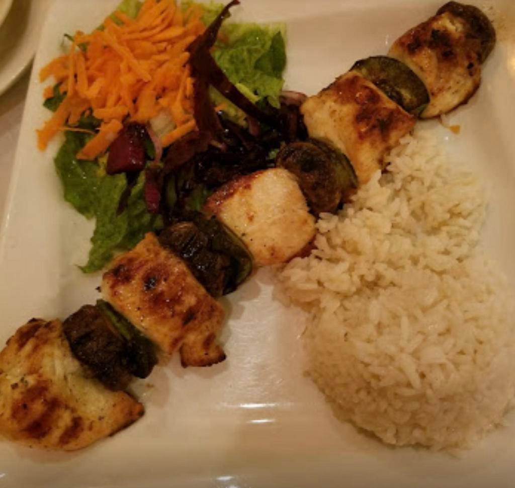 Chicken Shish Kebab · Char grilled chunks of tender chicken breast served with rice and salad. 