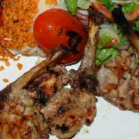 Chicken Chops · Char grilled tender chicken drums served with rice and salad. 