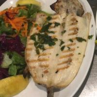 Whole Boneless Trout · Char grilled whole trout boneless served with salad and chef's special sauce.