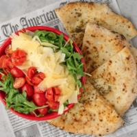 Arugula and Focaccia Salad · Arugula, shaved parmesan cheese, and cherry tomatoes. Served with a side of Foccacia bread. ...