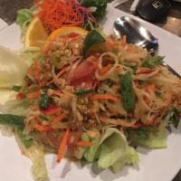 S1. Papaya Salad · Shredded green papaya, tomatoes, green beans, carrots , roasted peanuts, mixed with Thai  sp...