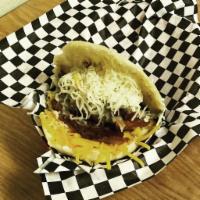Seattle Arepa · White corn meal pockets filled with shredded beef or signature pork & grated cheddar & monte...