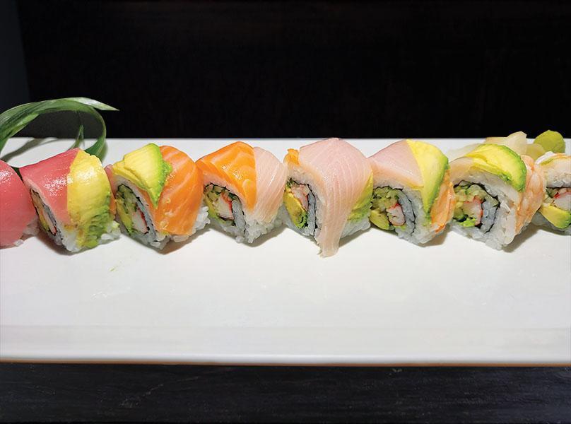 Rainbow Roll · California roll with fluke, yellowtail, tuna, salmon, white fish wrapped on top.