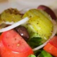 Lettuce and Tomato · Lettuce, tomato, olive and parsley with lemon juice and olive oil. Served with fresh baked p...
