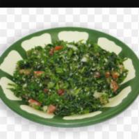 Tabouleh · Fresh chopped parsley with tomato, scallion, bulgur and lemon juice. Served with fresh baked...