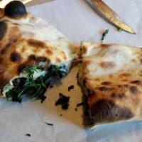 Spinach and Cheese Pie · Spinach, onion and spices with light mozzarella cheese, baked calzone style. Served with lem...