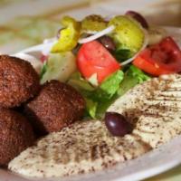 Falafel · Croquette of chickpeas mixed with garlic, onion, parsley and spices then deep fried. Served ...