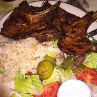 Lamb Chops Special · Marinated Halal baby lamb chops, grilled to your taste, served with rice, green salad and yo...