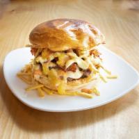 Colombian Burger · Comes with mozzarella cheese, ham, smoked bacon, potato stix, garlic sauce, pink sauce , pin...