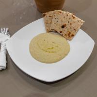 Hummus · Garbanzo beans puree with sesame sauce, lemon juice, garlic and olive oil.