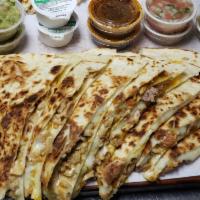 Jose's Shrimp Quesadilla · Jumbo size flour tortilla grilled shimp and melted cheese. Served with a side of rice, beans...
