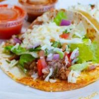 Gringo Tacos · 3 soft flour tortilla tacos with choice of meat, lettuce, cheese and pico de gallo with a si...