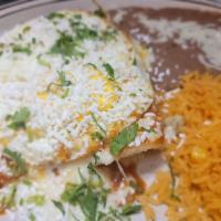 Enchiladas Campesinas · 2 Cheese Enchiladas topped with 2 ranchero style eggs covered with our warm tomatillo salsa,...