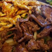 Fajitas Mixed (steak and chicken) · Grilled steak and chicken with onions and peppers. Served with rice, choice of refried or bl...