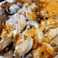 Chori - Mixto · Steak, chicken and shrimp grilled with Mexican chorizo on a bed of Mexican rice, topped with...