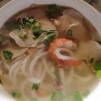 66. Banh Canh Tom Thit · Shrimp pork and seafood round-shaped rice noodle soup.
