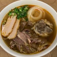 63. Bun Bo Hue · Beef noodle soup - hue style, and spicy.