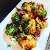 Crispy Brussels and Bacon · Crispy sprouts flash fried with applewood smoked bacon, tossed in a sherry vinaigrette, serv...