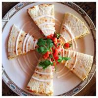 Smoked Chicken and Hatch Green Chile Quesadillas · Hickory house smoked chicken breast with roasted red peppers, hatch green chiles and mild ch...