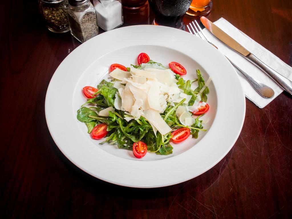 Arugula Salad  · Arugula, shaved Parmesan, cherry tomatoes and house balsamic vinaigrette.