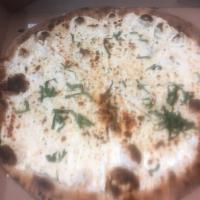 White Pizza  · Ricotta cheese, roasted garlic, oregano and fresh basil. Made with fresh house made mozzarel...