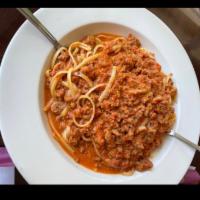 Pasta Bolognese · Served with choice of pasta. 