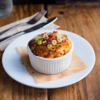 Baked Mac & Cheese · Topped with breadcrumbs, bacon bits and green onions.