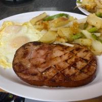 Breakfast Ham Steak & Eggs · Thick sliced cured ham. Choice of fried, scrambled, over easy, or sunny side up eggs.