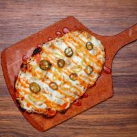 BUFFALO CHICKEN* · Olive oil base, topped with mozzarella cheese, seasoned chicken, jalapenos, and banana peppe...