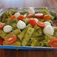 PASTA CAPRESE* · Rigatoni pasta with basil cream sauce with fresh mozzarella pearls and fresh cherry tomatoes...