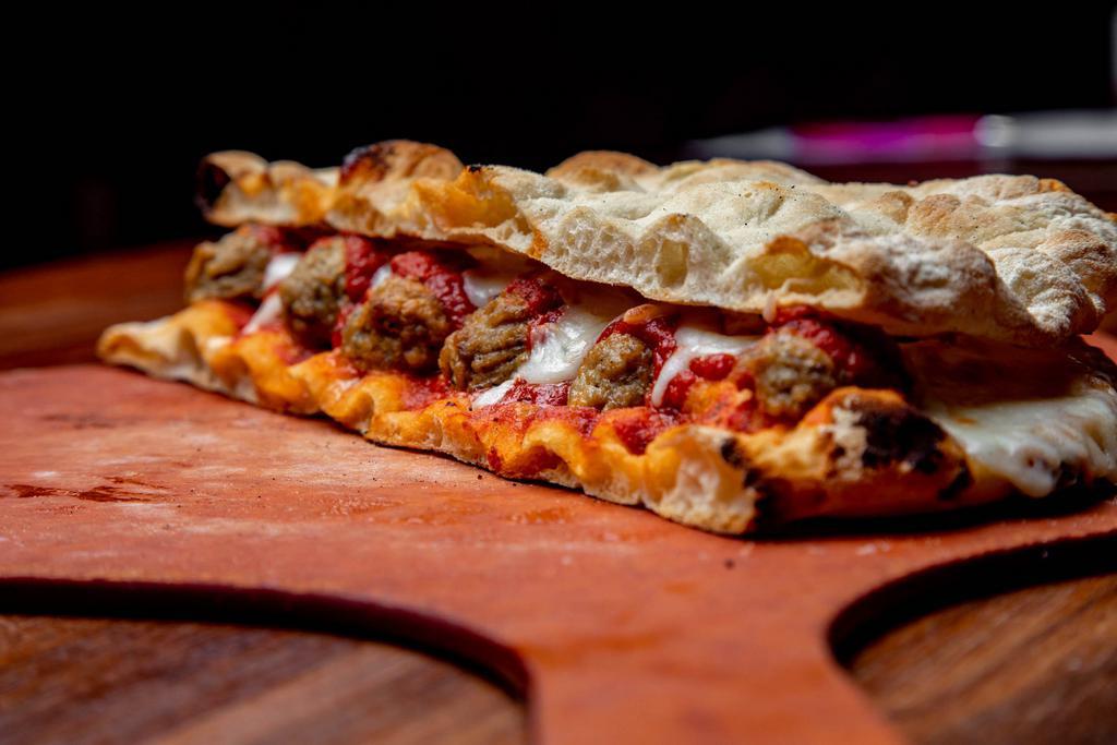 MEATBALL PANINO* · Pinsa bread base, Scimeca’s meatballs, mozzarella cheese, and San Marzano tomato sauce.