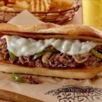 Philly · Melt-in-your-mouth philly steak or chicken smothered with grilled peppers, onions, and mushr...