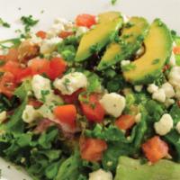 Chopped Cobb Salad · Crisp salad greens tossed with chunks of chicken, applewood bacon, croutons, cucumbers, dice...