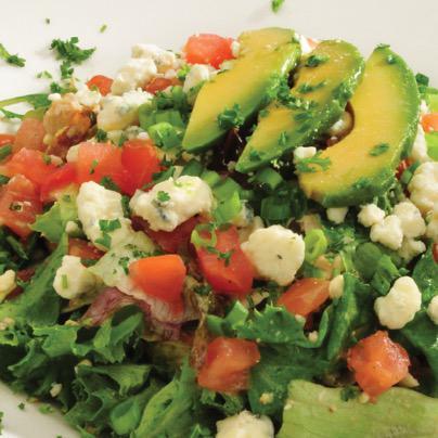 Chopped Cobb Salad · Crisp salad greens tossed with chunks of chicken, applewood bacon, croutons, cucumbers, diced tomatoes, chopped egg, bleu cheese crumbles and balsamic vinaigrette with avocado slices.