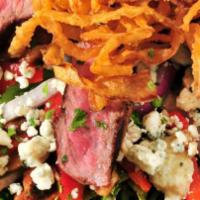 Beef and Bleu Salad · Crisp salad greens topped with sliced sirloin, bleu cheese crumbles, roasted red peppers, re...