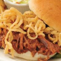 Memphis Pork Sandwich · Tender pulled pork BBQ with crispy onion straws on a toasted roll. Served with french fries.