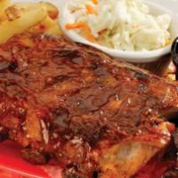 Baby Back BBQ Ribs · Tender and meaty BBQ baby back ribs basted with our award-winning sauce. Served with colesla...