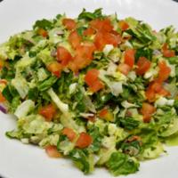 Chopped Salad · Chopped iceberg and romaine lettuce mix, English cucumbers, blue cheese crumbles, bacon, cho...