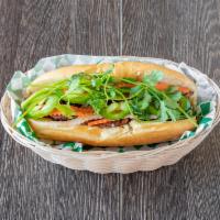 Grilled Pork Sandwich · Banh Mi Thit Nuong - Marinated Grilled Pork Sandwich Topped with Mayo, Pickled Carrots, Pick...
