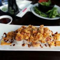 Popcorn Lobster Roll · California roll topped w/ popcorn langostino, eel sauce, & spicy mayo