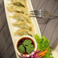 5. Pot Stickers · Pan-fried vegetable and mushrooms stuffed dumplings. Served with Thai ponzu sauce. Contains ...