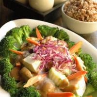 29. Bangkok Cafe Bathing Rama · Soft tofu on bed of spinach and seasonal vegetables, with caramelized onions & mushrooms and...